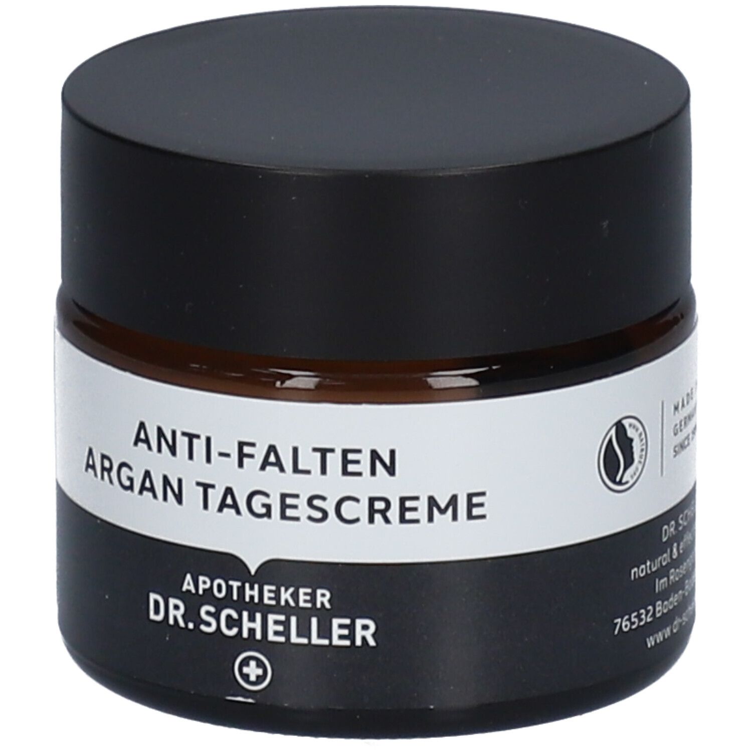 Braunes Creme-Glas mit schwarzem Deckel. Produktname und Logo auf dem Etikett. Vegan-Siegel.