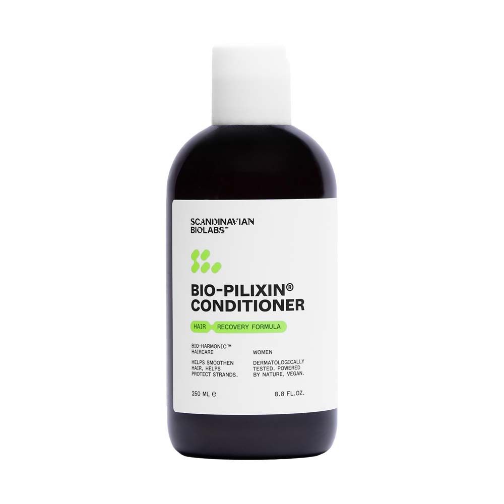 Dunkle Flasche mit weißem Deckel. Aufschrift: Bio-Pilixin Conditioner. Grün-weiße Grafik. 250 ml.