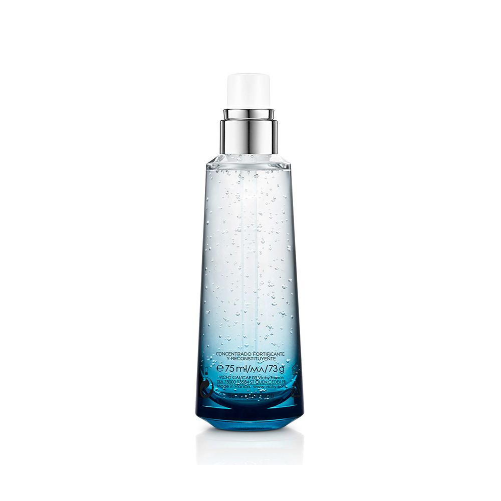 Eine Flasche Vichy Minéral 89. Blaue Flüssigkeit in einer transparenten Flasche mit silbernem Pumpkopf.