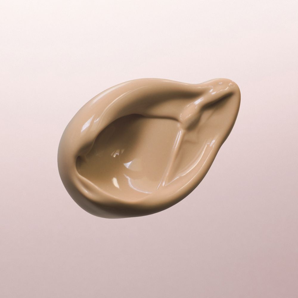Louis Widmer nutriderm getönte Tagescreme UV 20, Bronze 02, Produktprobe auf rosa Hintergrund.