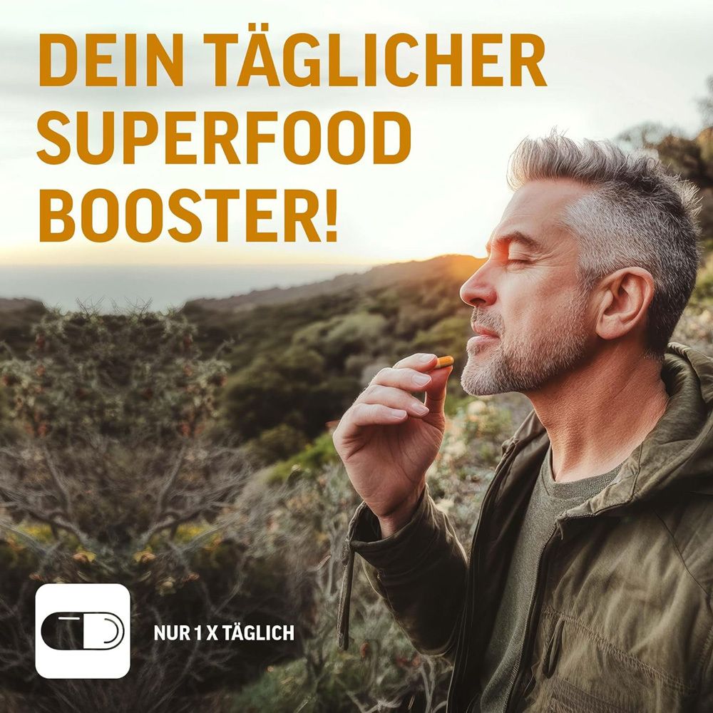 Mann hält Kapsel. Text: Dein täglicher Superfood Booster! Nur 1x täglich.