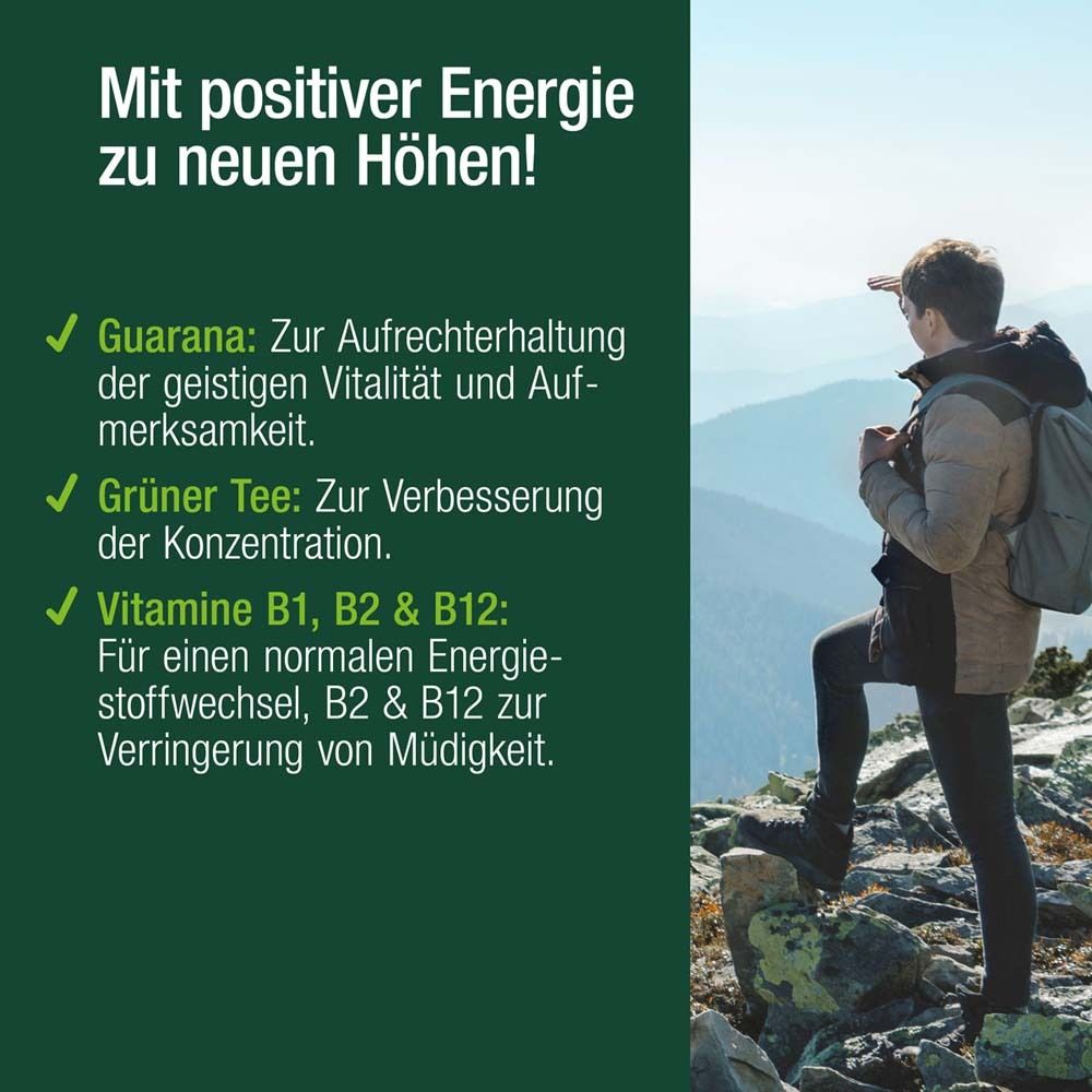Person steht auf Berg. Text: Mit positiver Energie zu neuen Höhen! Guarana, Grüner Tee, Vitamine B1, B2 & B12.