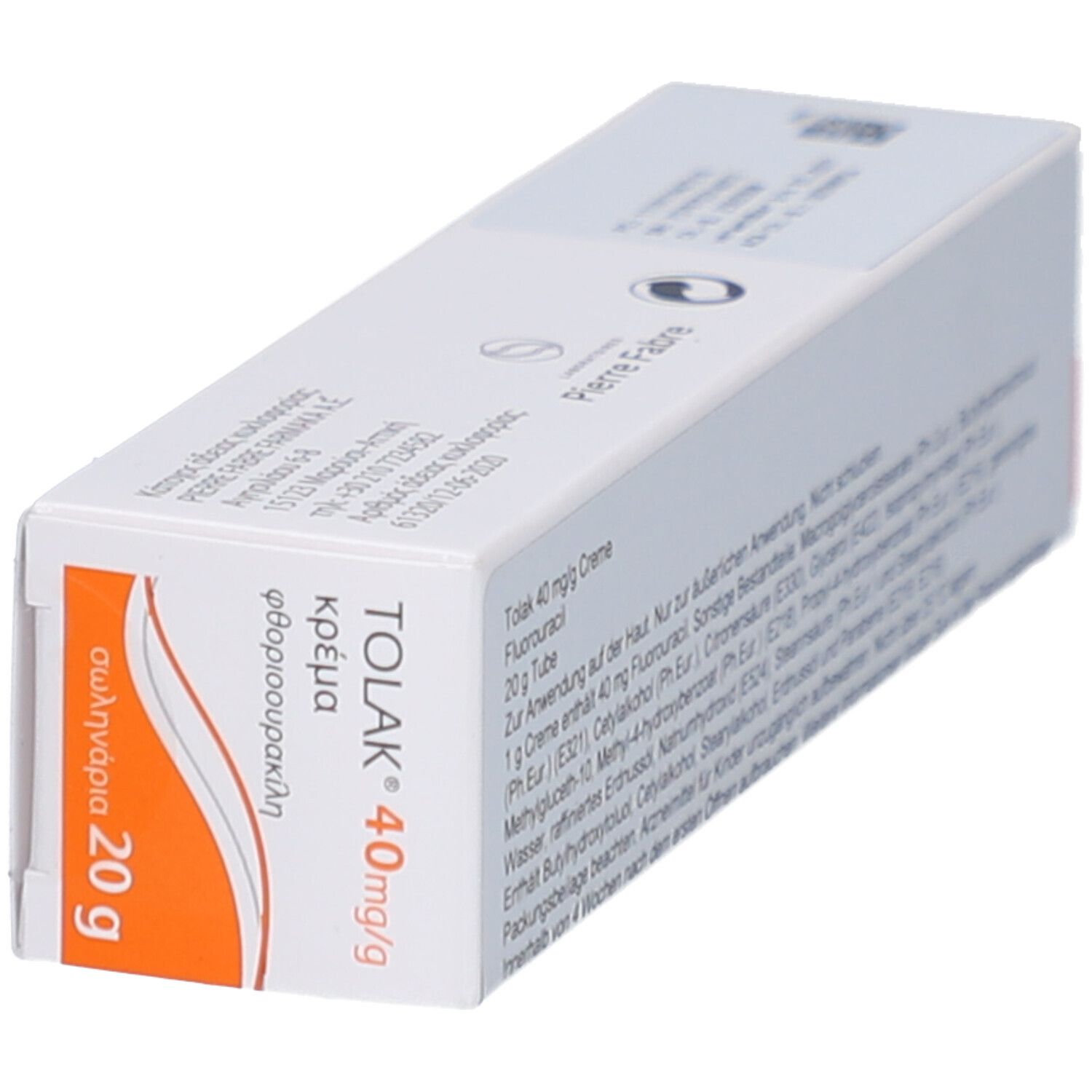 Schräg gestellte weiße Faltschachtel. Aufdruck: TOLAK 40mg/g, griechische Schriftzeichen, 20 g. Orangefarbener Streifen.