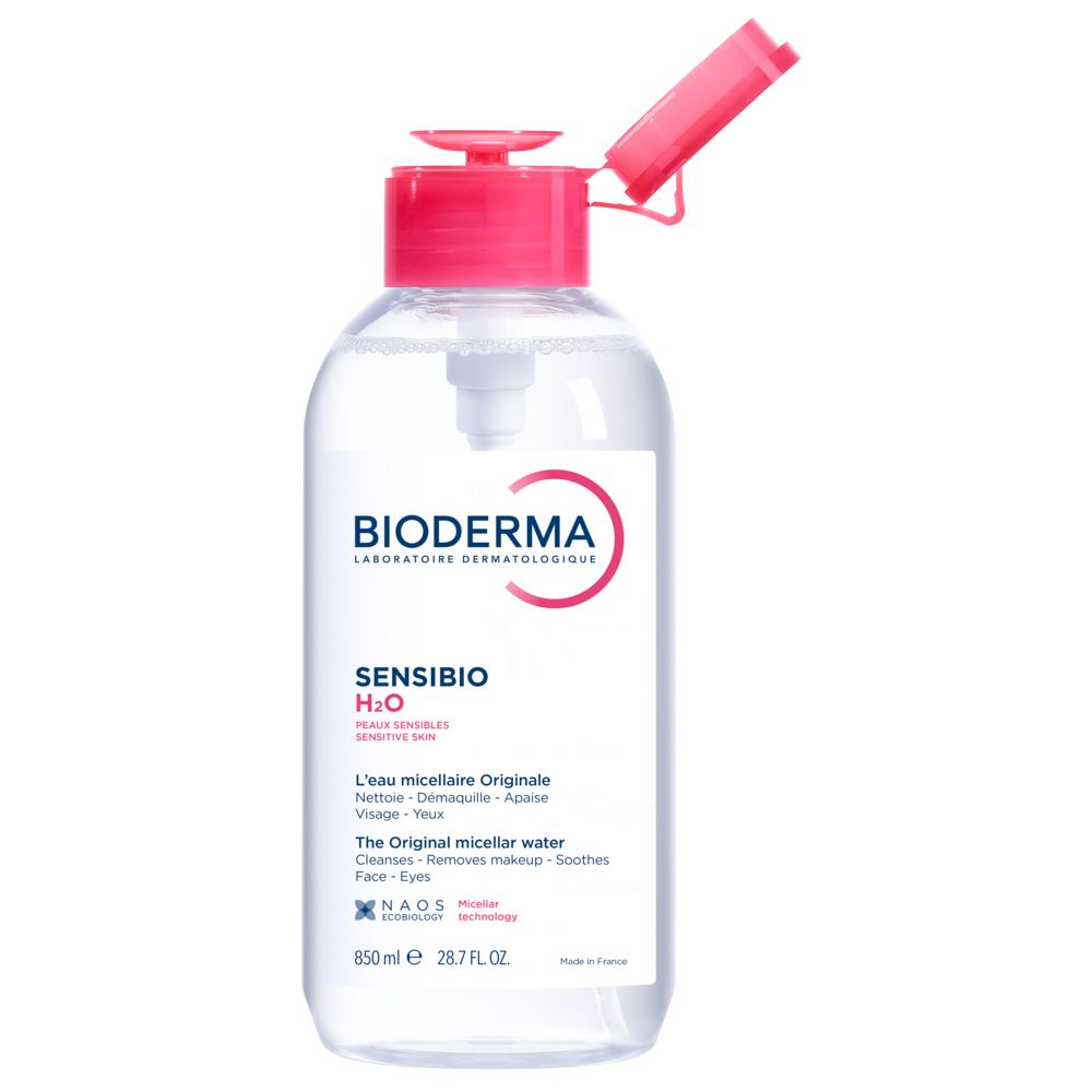 Bioderma Sensibio H2O Mizellenwasser in durchsichtiger Flasche mit rosa Pumpspender und Klappdeckel.