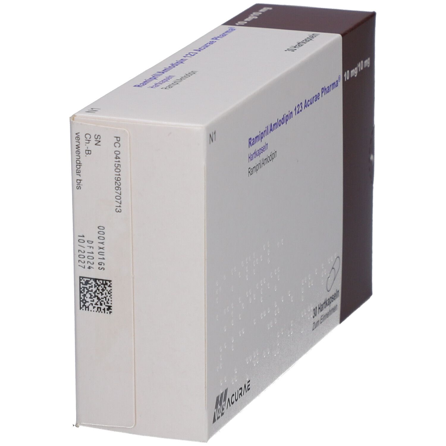 Schachtel mit Medikamenten, schräg. Aufschrift: Ramipril/Amlodipin 123 Acurae Pharma. Weiße Verpackung mit brauner Seite. Barcode und Text.