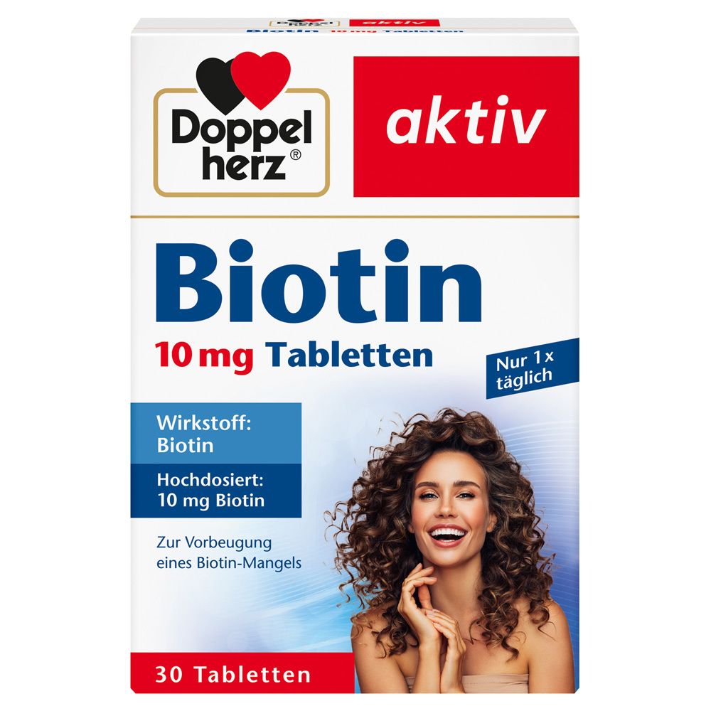 Schachtel mit Doppelherz aktiv Biotin 10 mg Tabletten. Enthält 30 Tabletten. Frau mit lockigen Haaren.