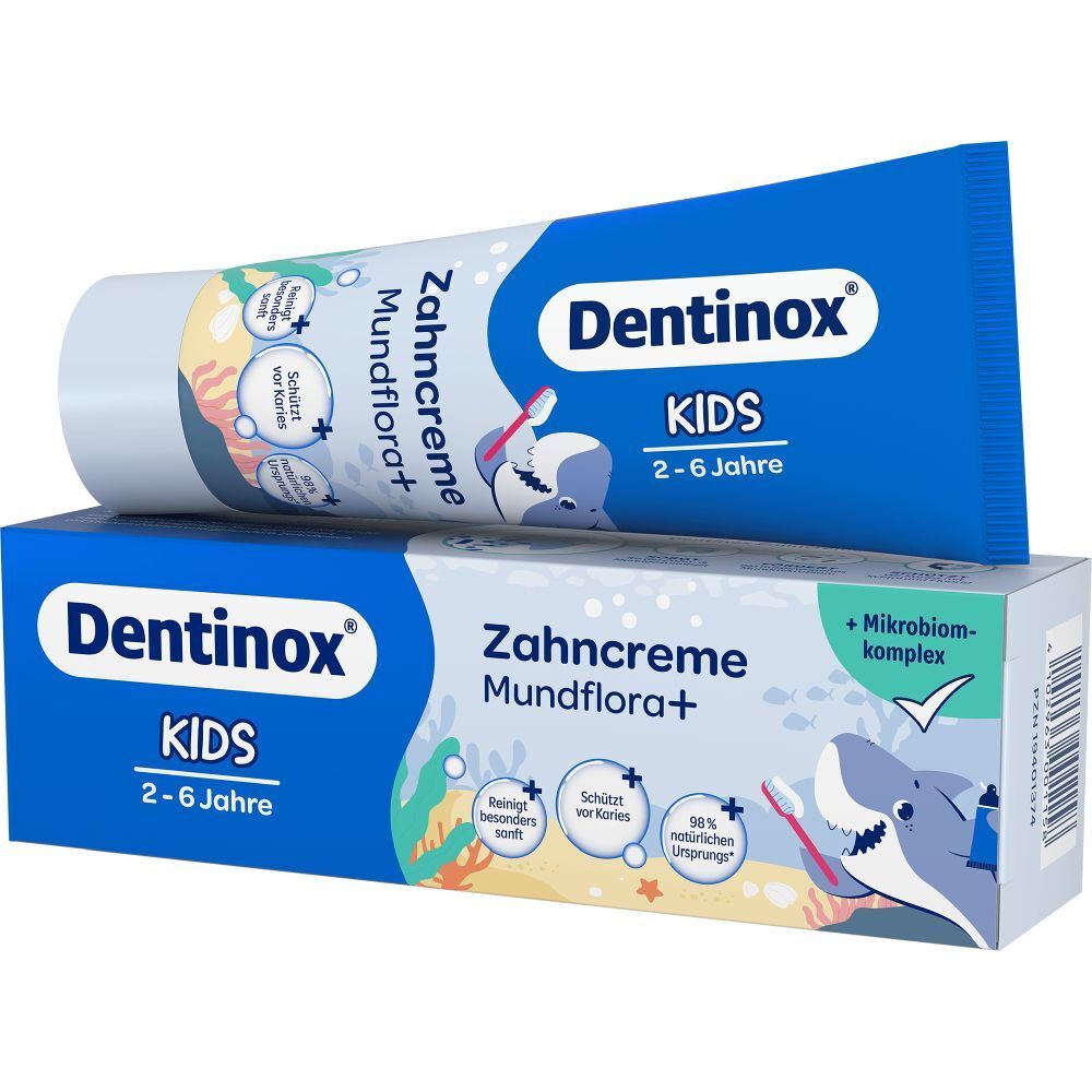 Dentinox KIDS Zahnpasta-Tube und -Packung. Tube liegt auf der Schachtel. Produktname und Illustrationen sind sichtbar. Altersempfehlung 2-6 Jahre.
