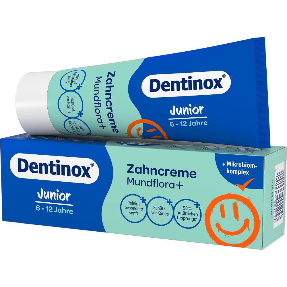 Zahncreme-Tube und Schachtel. Aufschrift: Dentinox Junior, Zahncreme Mundflora+, 6-12 Jahre. Tube mit blauem Deckel.