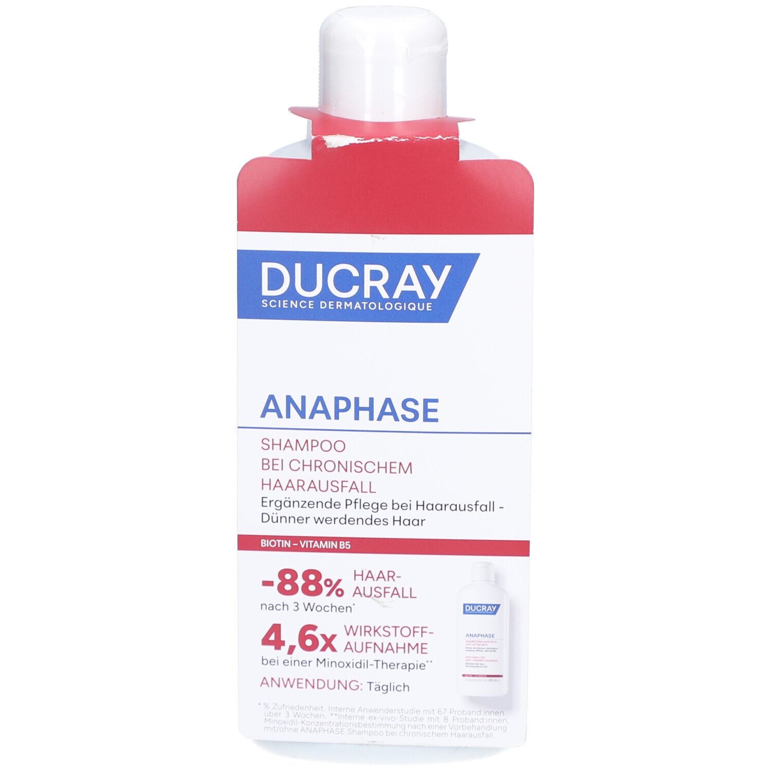 Shampoo-Flasche mit rotem Etikett. Aufschrift: DUCRAY, ANAPHASE, Shampoo bei chronischem Haarausfall.