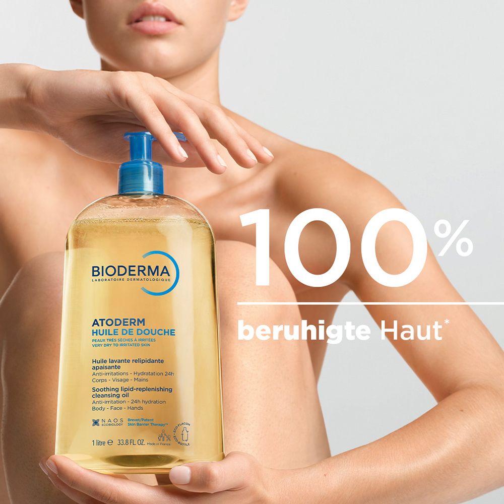Bioderma Atoderm Duschöl in 1L Flasche mit blauem Pumpspender. Klare, gelbliche Flüssigkeit.