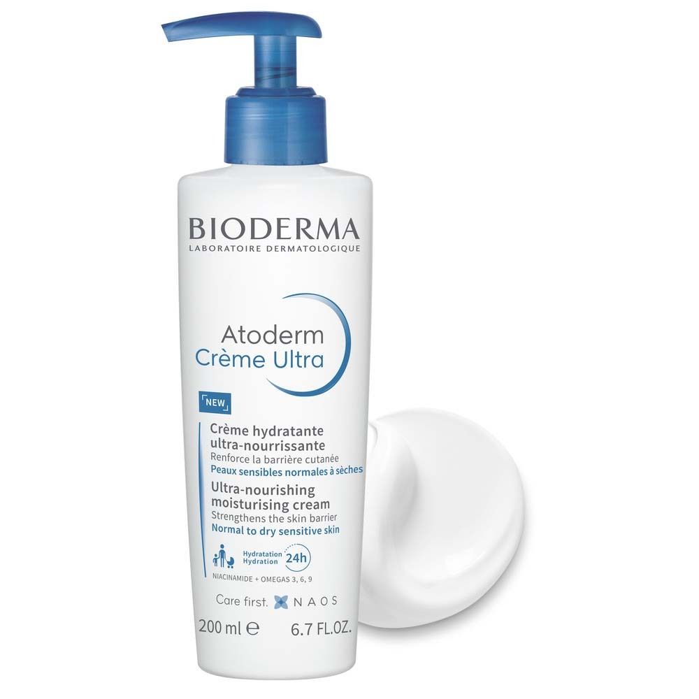 Weiße Flasche mit blauem Pumpkopf und Creme. Aufschrift: BIODERMA, Atoderm Crème Ultra. Text in Französisch und Englisch.