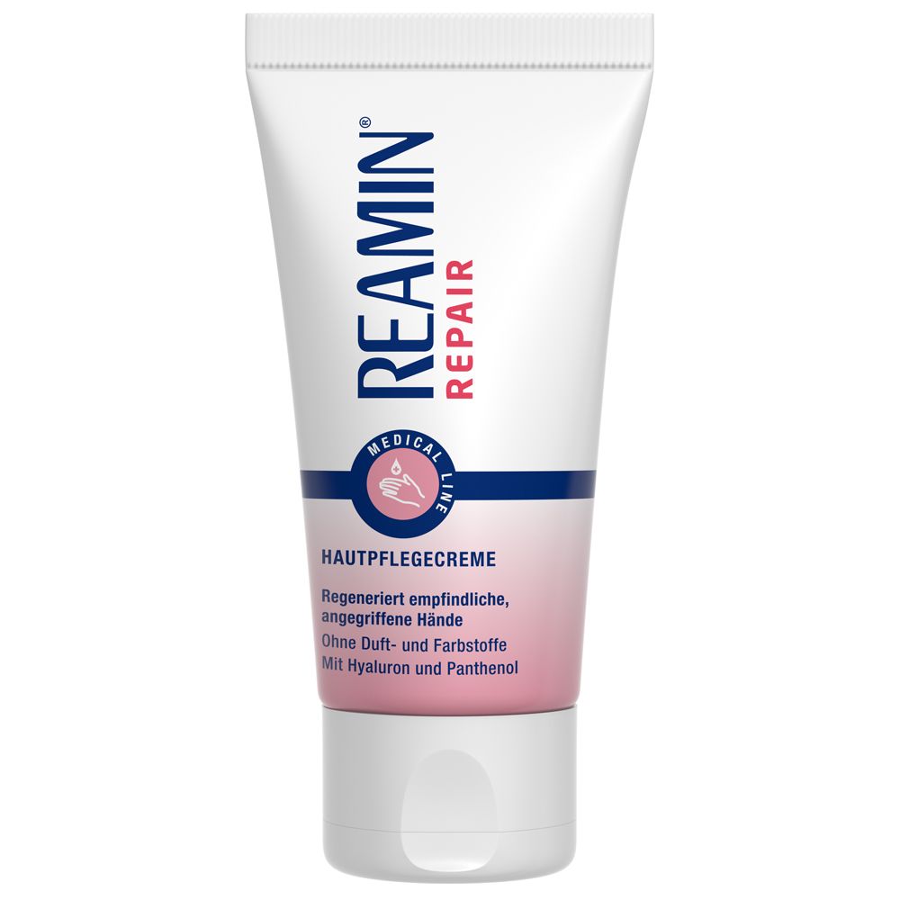 Weiße Tube mit blauem und rosa Design. Oben steht "REAMIN REPAIR". Darunter "HAUTPFLEGECREME".
