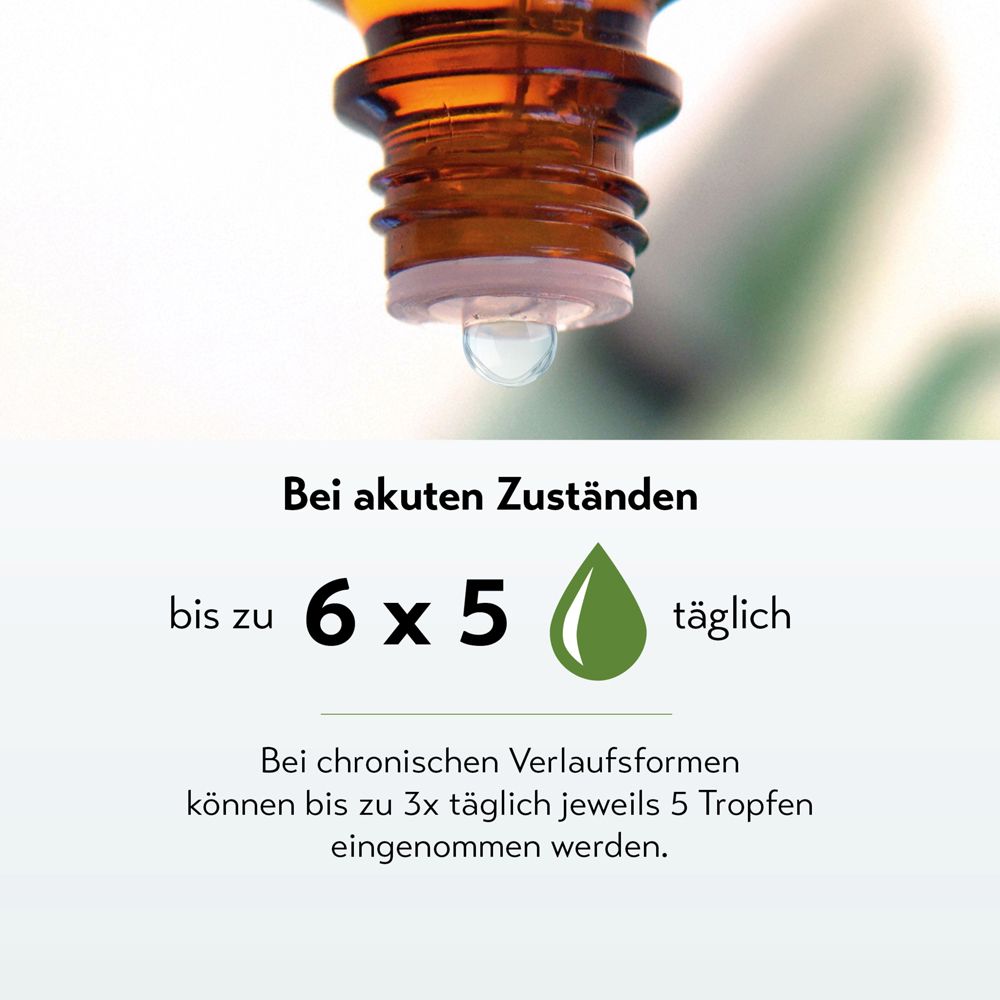 Tropfen fällt aus einer Flasche, Text zur Dosierung.