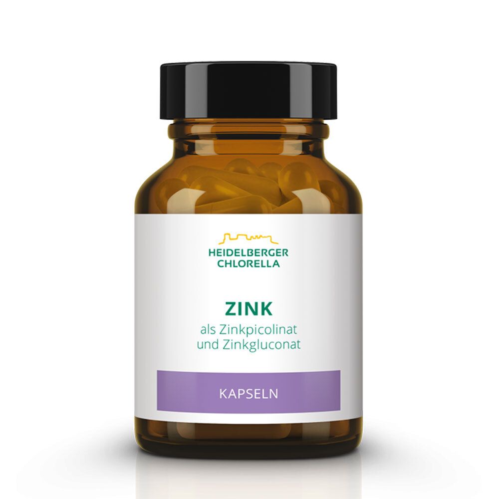 Braune Glasflasche mit schwarzen Deckel. Etikett mit Schriftzug Zink, Kapseln und Logo. Kapseln sichtbar.