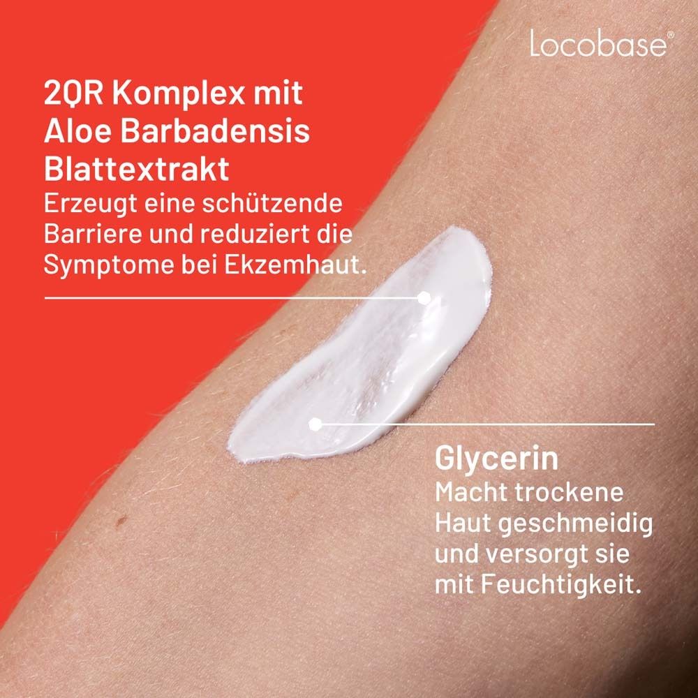 Creme auf Haut aufgetragen. Text: 2QR Komplex mit Aloe. Glycerin. Macht trockene Haut geschmeidig.