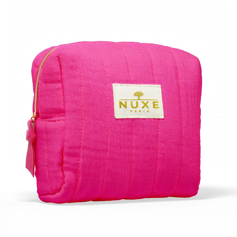 Pinkfarbene Kosmetiktasche mit goldfarbenem Reißverschluss und Logo "NUXE PARIS".
