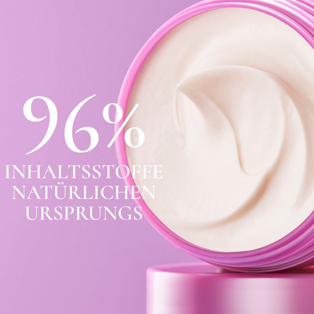 Rosa Dose mit weißer Creme. Text: 96% INHALTSSTOFFE NATÜRLICHEN URSPRUNGS. NUXE Haarmaske.