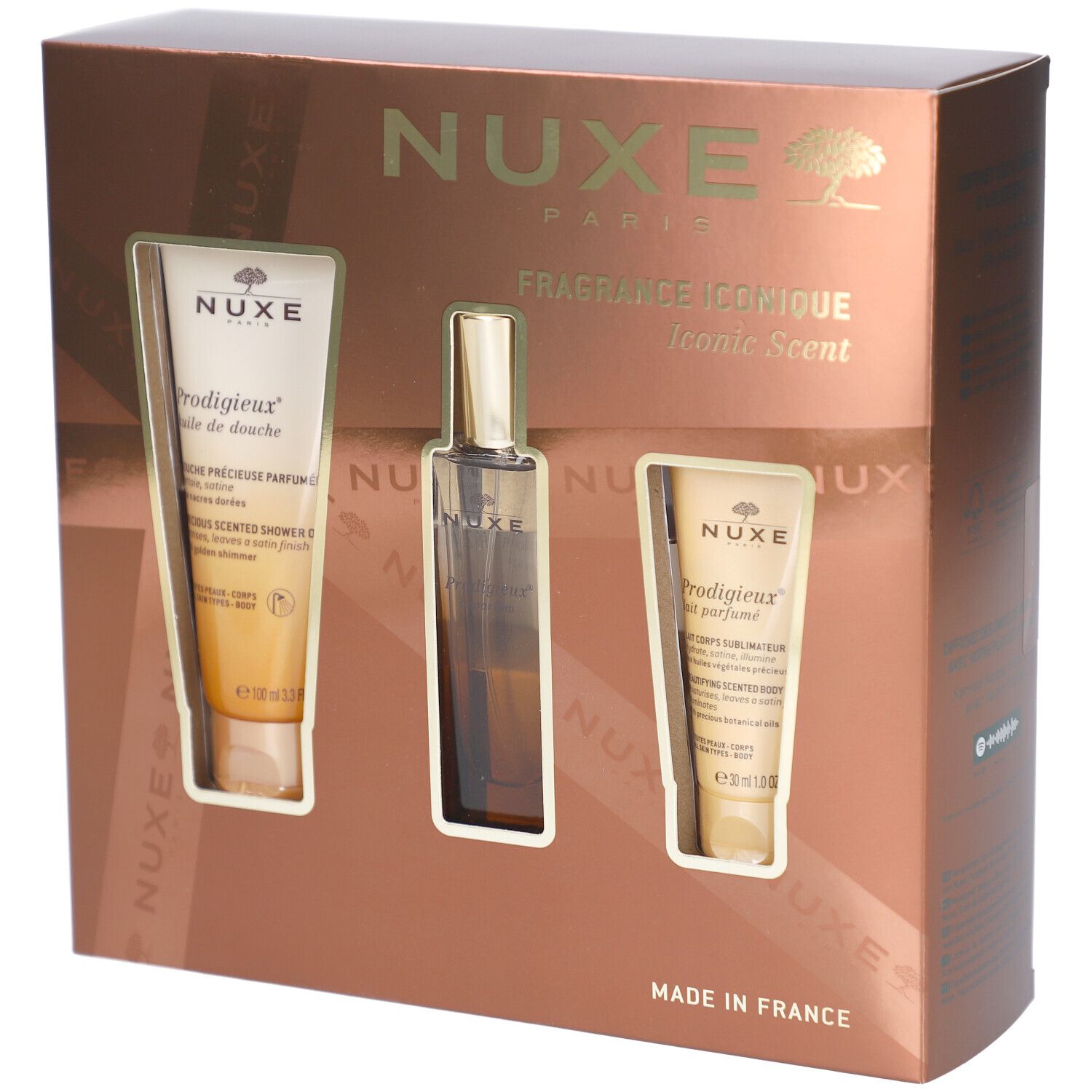 Geschenkset mit drei Produkten in einer braunen Schachtel. Enthält eine Duschcreme, ein Parfum und eine Körperlotion. NUXE-Logo.