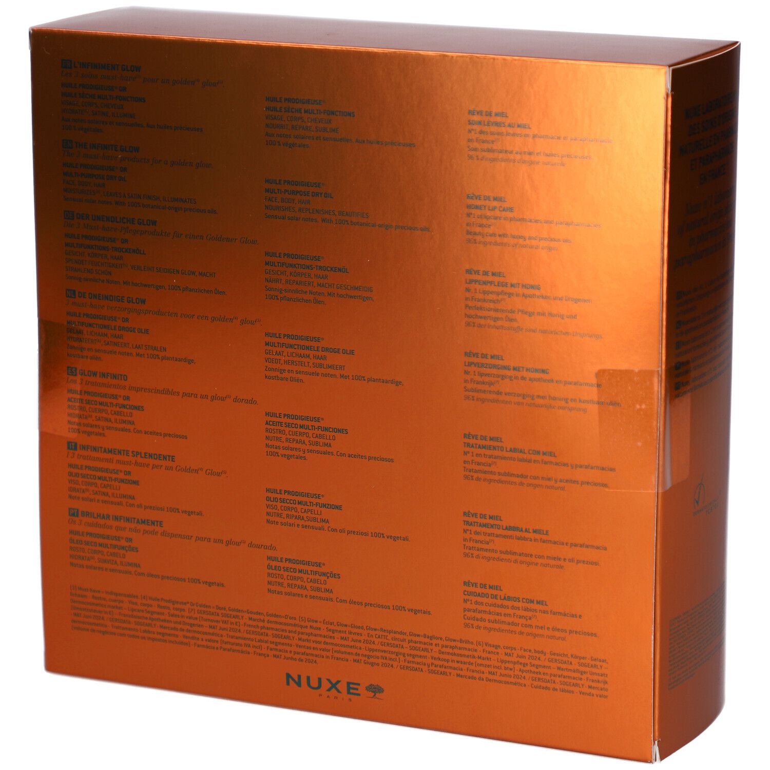 Rückseite der goldfarbenen Geschenkbox. Mehrsprachiger Text. NUXE-Logo unten rechts.