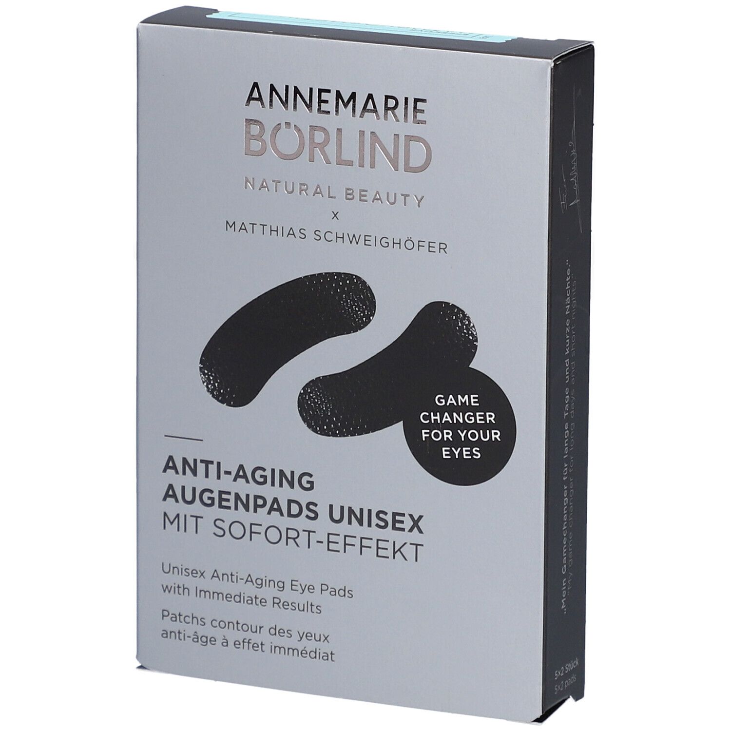 Graue Verpackung mit schwarzen Augenpads. Schriftzug: ANNEMARIE BÖRLIND, Anti-Aging Augenpads Unisex. Mit Sofort-Effekt. Game Changer for your eyes.