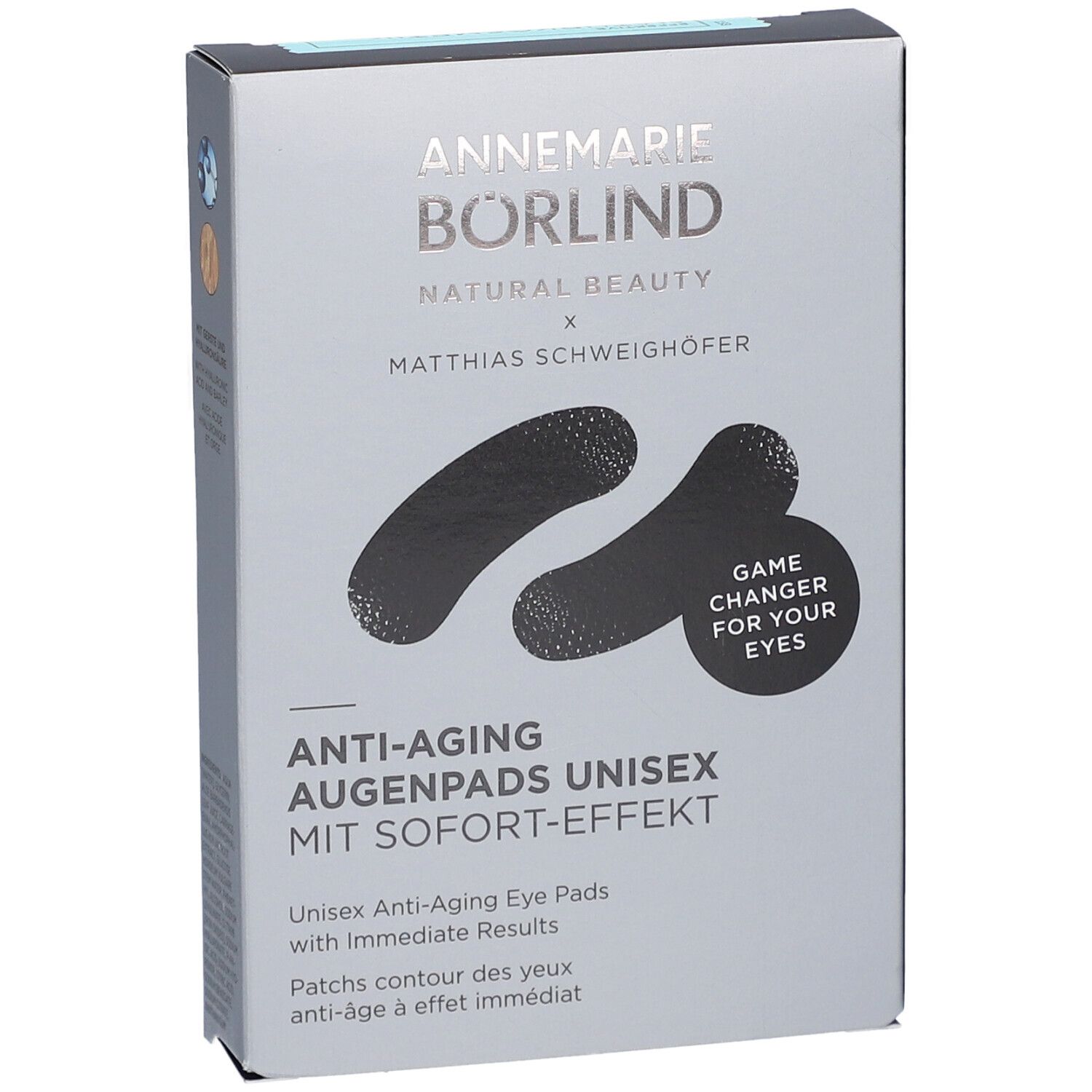 Graue Verpackung mit schwarzen Augenpads. Schriftzug: ANNEMARIE BÖRLIND, Anti-Aging Augenpads Unisex. Mit Sofort-Effekt. Game Changer for your eyes.
