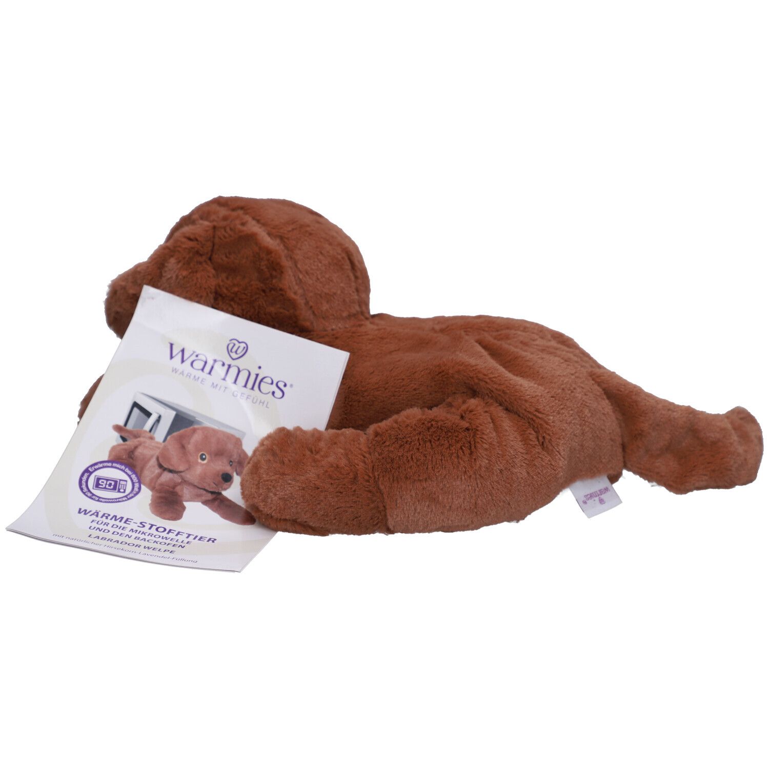 Brauner Stoffhund mit Etikett. Marke Warmies. Weiches Material, liegende Position. Produktabbildung auf Etikett.