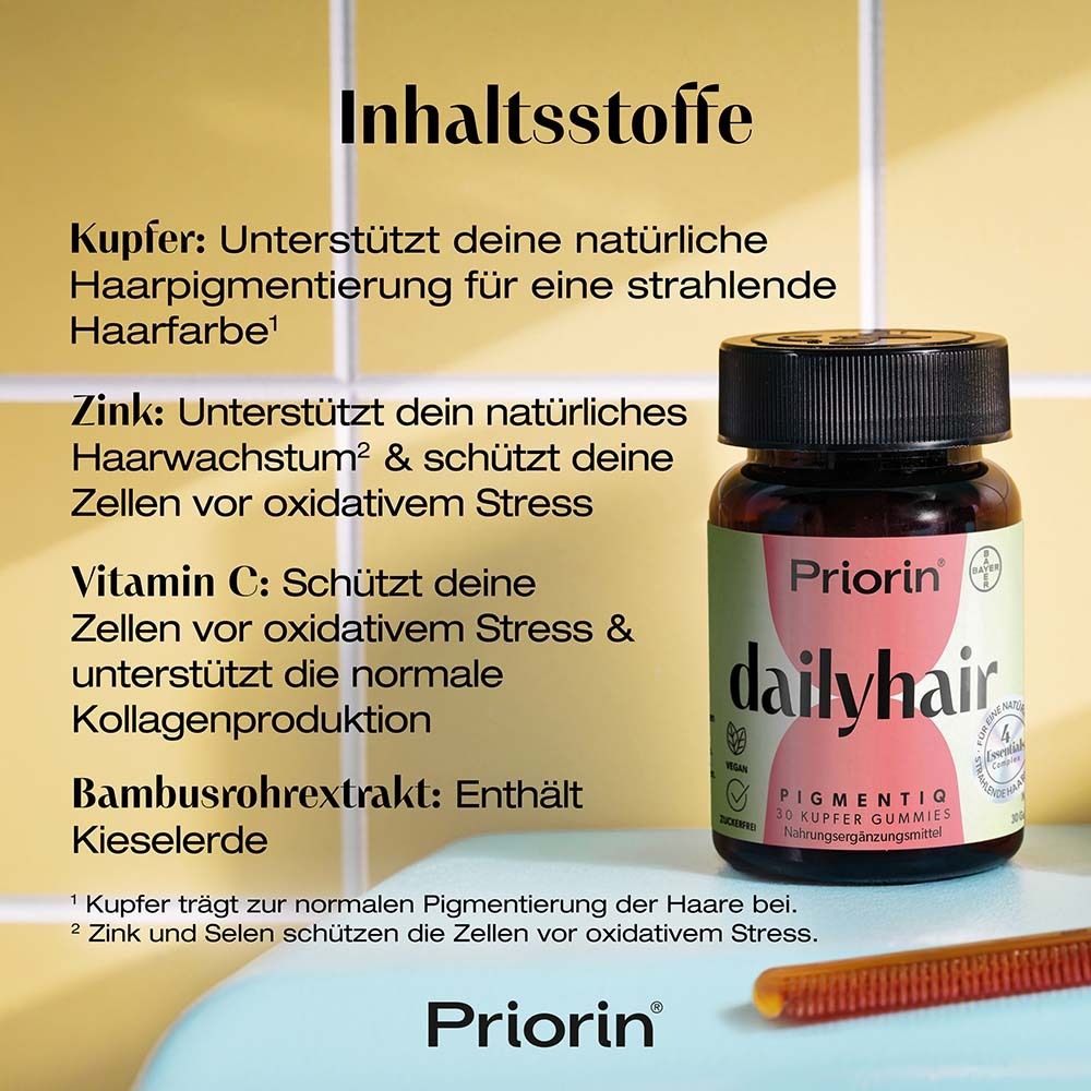 Text mit Inhaltsstoffen: Kupfer, Zink, Vitamin C, Bambus. Flasche Priorin dailyhair. Roter Kamm.