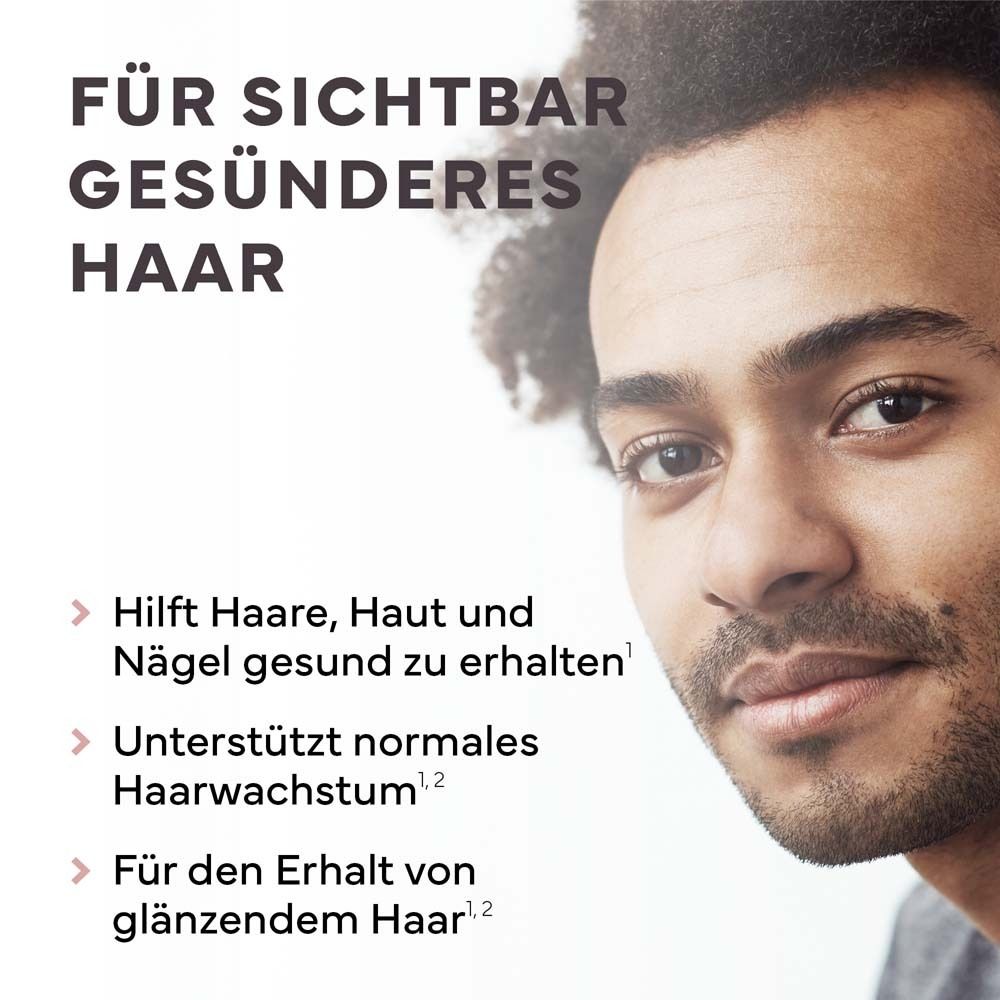 Porträt eines Mannes. Text: Für sichtbar gesünderes Haar. Hilft Haare, Haut und Nägel gesund zu erhalten. Unterstützt Haarwachstum.