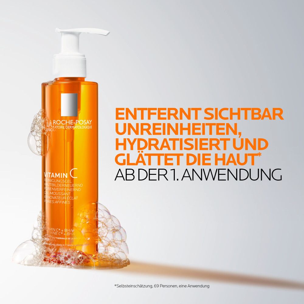 Orangefarbene Flasche mit Pumpe. Text: Entfernt Unreinheiten, hydratisiert, glättet die Haut ab der 1. Anwendung.