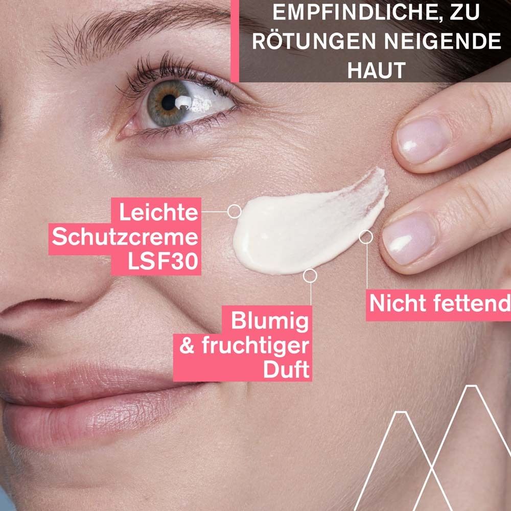 Gesicht mit Creme-Auftrag. Text: Leichte Schutzcreme LSF30, Blumig & fruchtiger Duft, Nicht fettend.