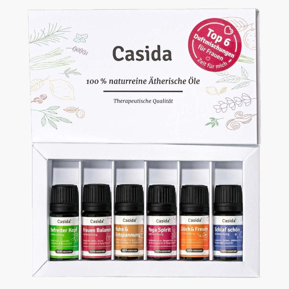 Sechs Fläschchen ätherischer Öle in einer weißen Schachtel. Auf der Schachtel steht "Casida" und "Top 6 Duftmischungen für Frauen".