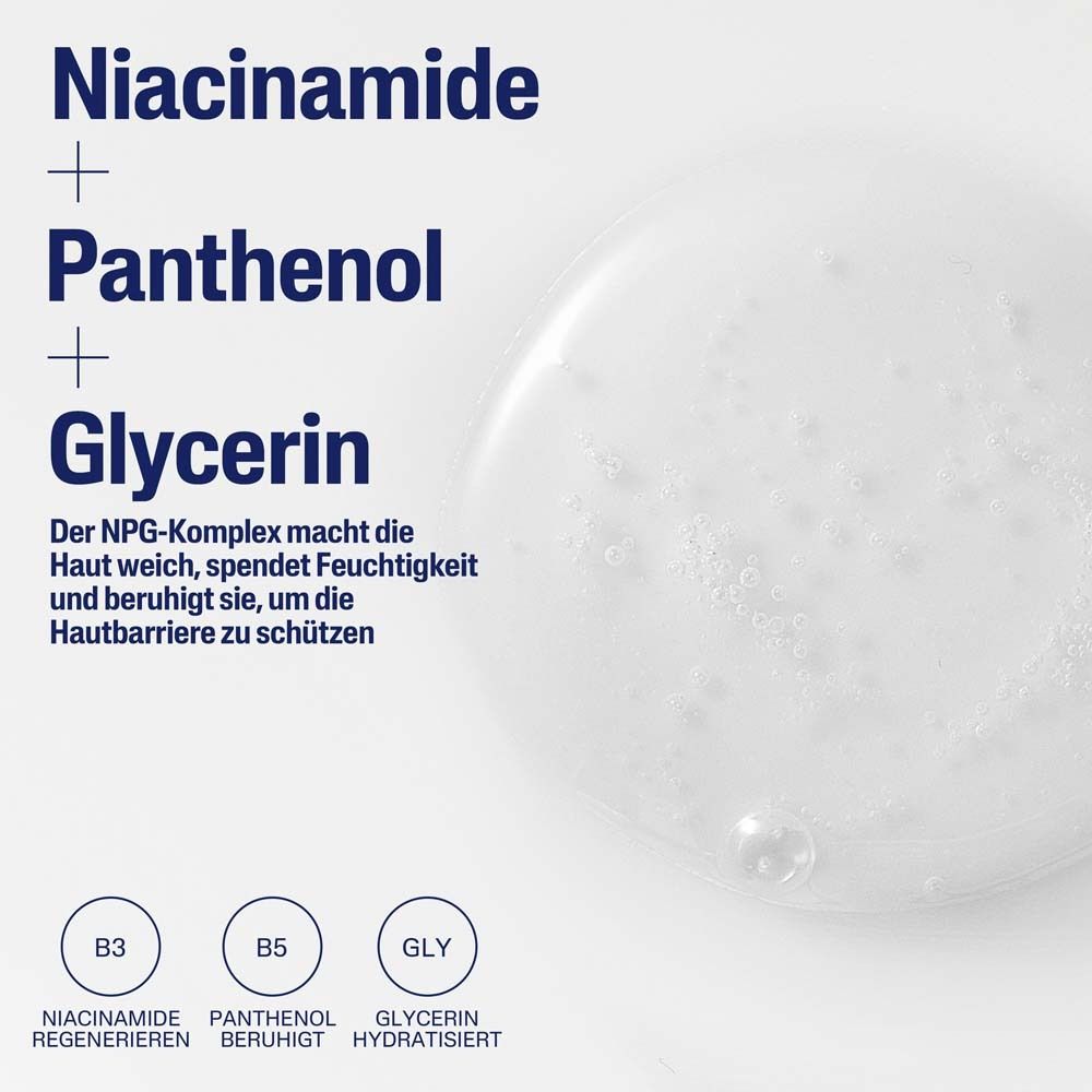 Nahaufnahme einer weißen Flüssigkeit mit Blasen. Text: Niacinamid + Panthenol + Glycerin. Der NPG-Komplex macht die Haut weich.