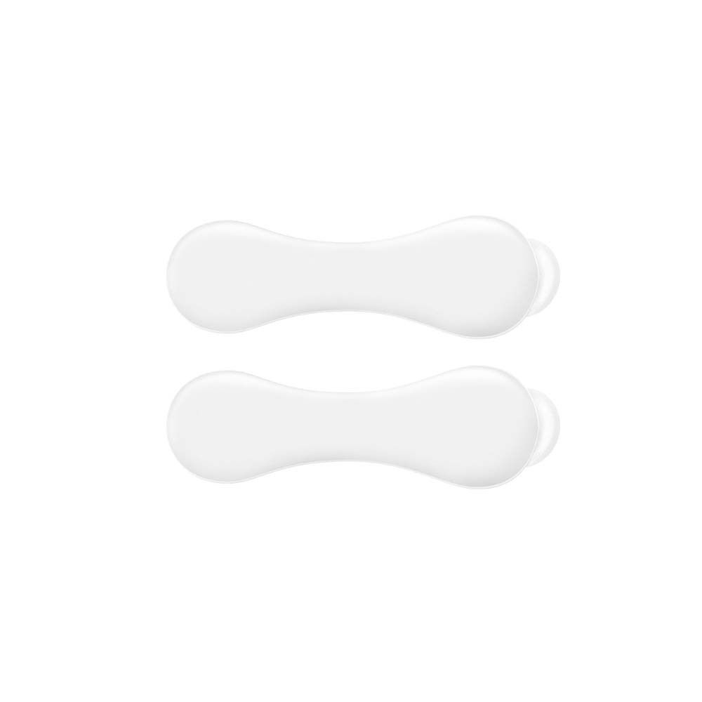 Zwei weiße, ovale Mund Pads. Sie haben eine schmale, längliche Form mit abgerundeten Enden.