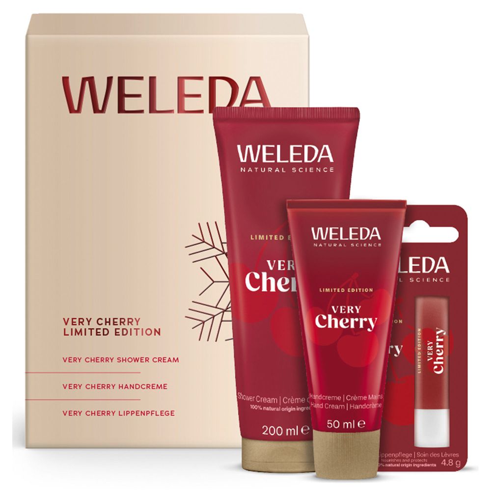 Weleda Geschenkset. Enthält Duschcreme, Handcreme und Lippenpflege. Rote Tuben und Lippenpflegestift. Beige Verpackung.