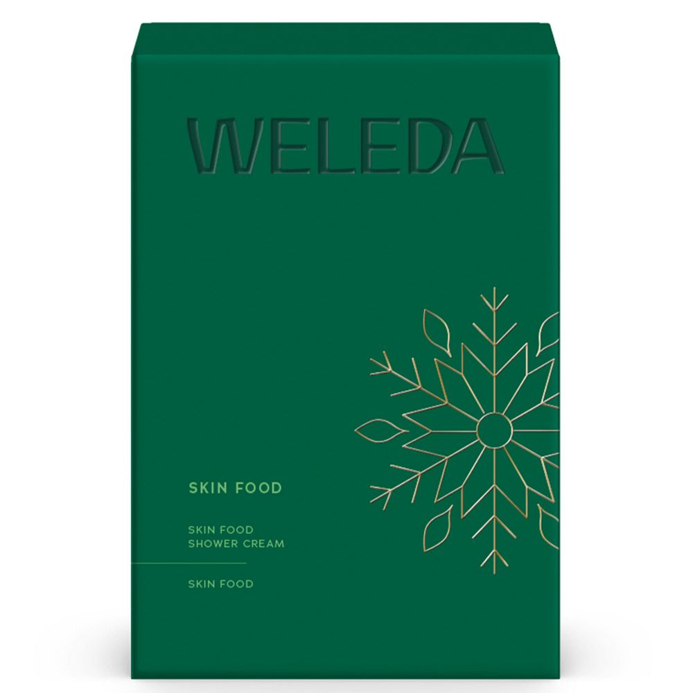 Grüne Schachtel mit WELEDA-Logo und Skin Food-Schriftzug. Goldfarbenes Schneeflocken-Design.
