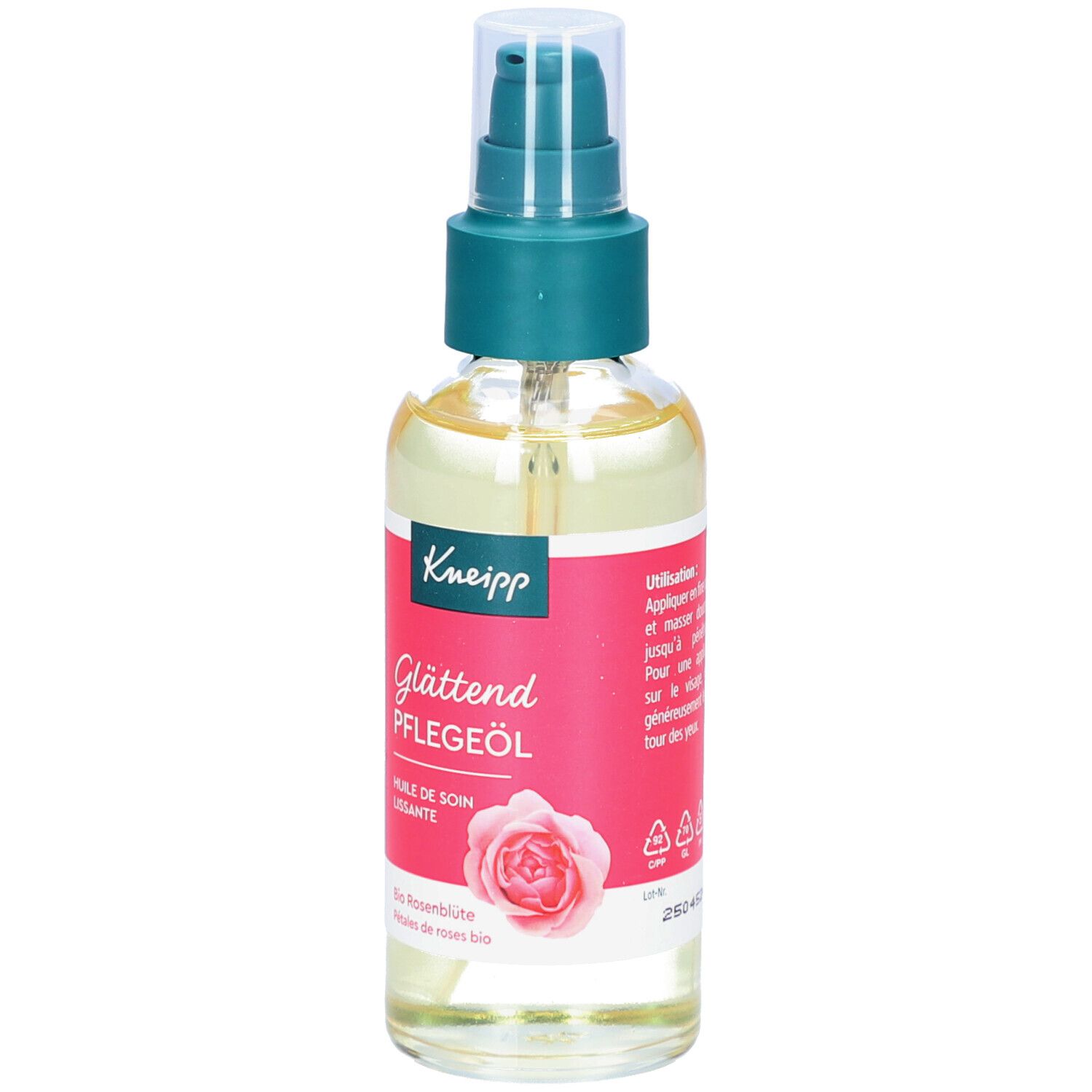 Glasflasche mit Pflegeöl und Sprühkopf. Roter Aufkleber mit Produktbezeichnung, Rosenblüten-Illustration und Markennamen.