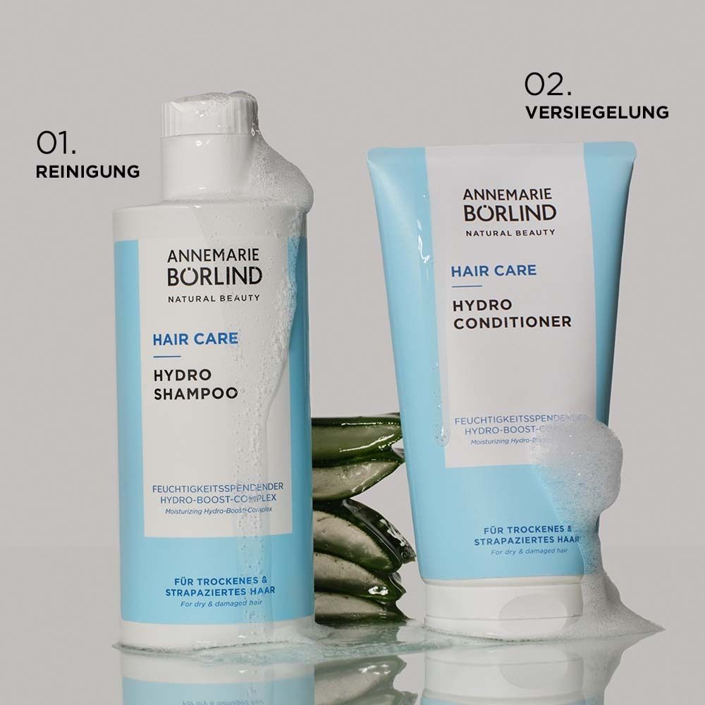 Weiße Flasche mit blauem Etikett. Aufschrift: ANNEMARIE BÖRLIND, Hair Care Hydro Shampoo.