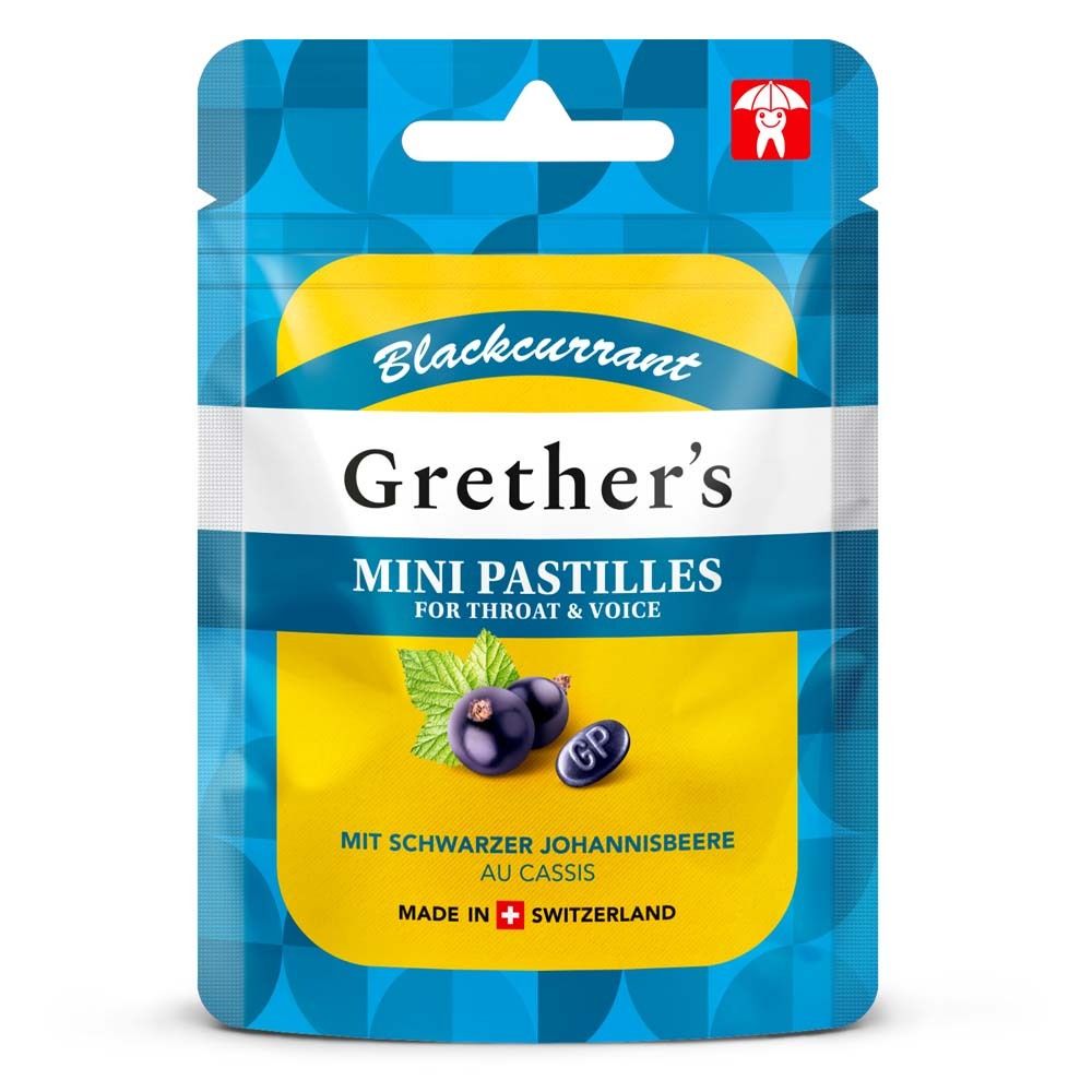 Beutel mit Pastillen. Aufschrift: Grether's Mini Pastillen, Schwarze Johannisbeere. Logo: Zahn mit Regenschirm. Hergestellt in der Schweiz.