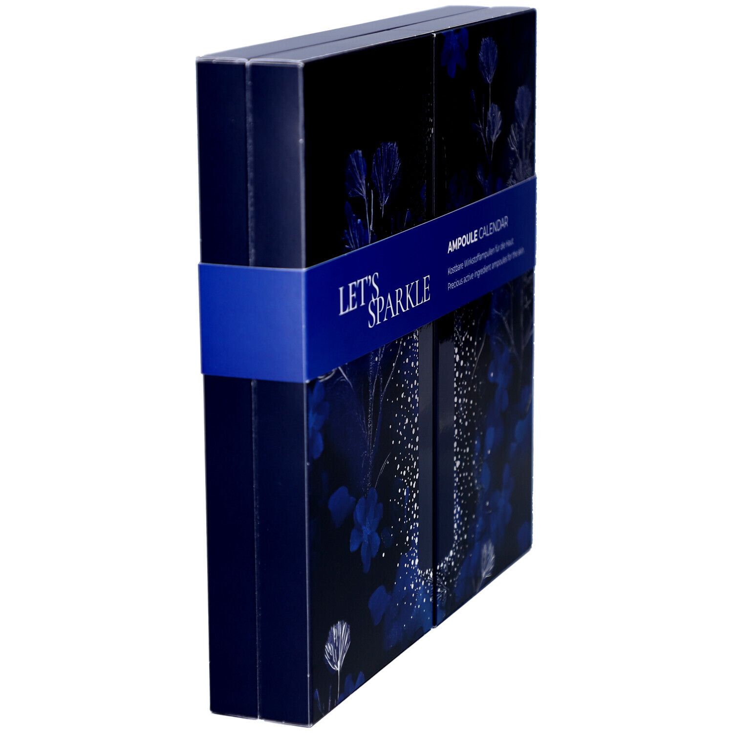 Seitenansicht des Adventskalenders. Blaue Verpackung mit floralem Muster und blauem Band. Aufschrift "LET'S SPARKLE" und "AMPOULE CALENDAR".
