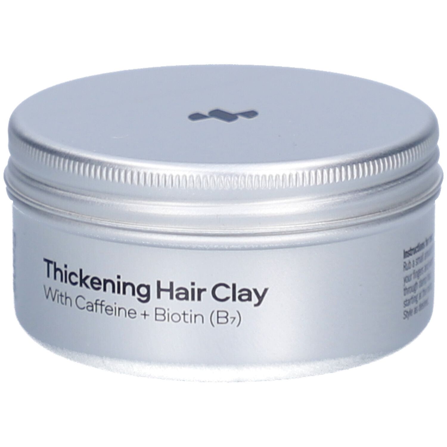 Silberfarbene Dose mit Deckel. Aufschrift: Thickening Hair Clay, With Caffeine + Biotin (B7). Marke: Sons.