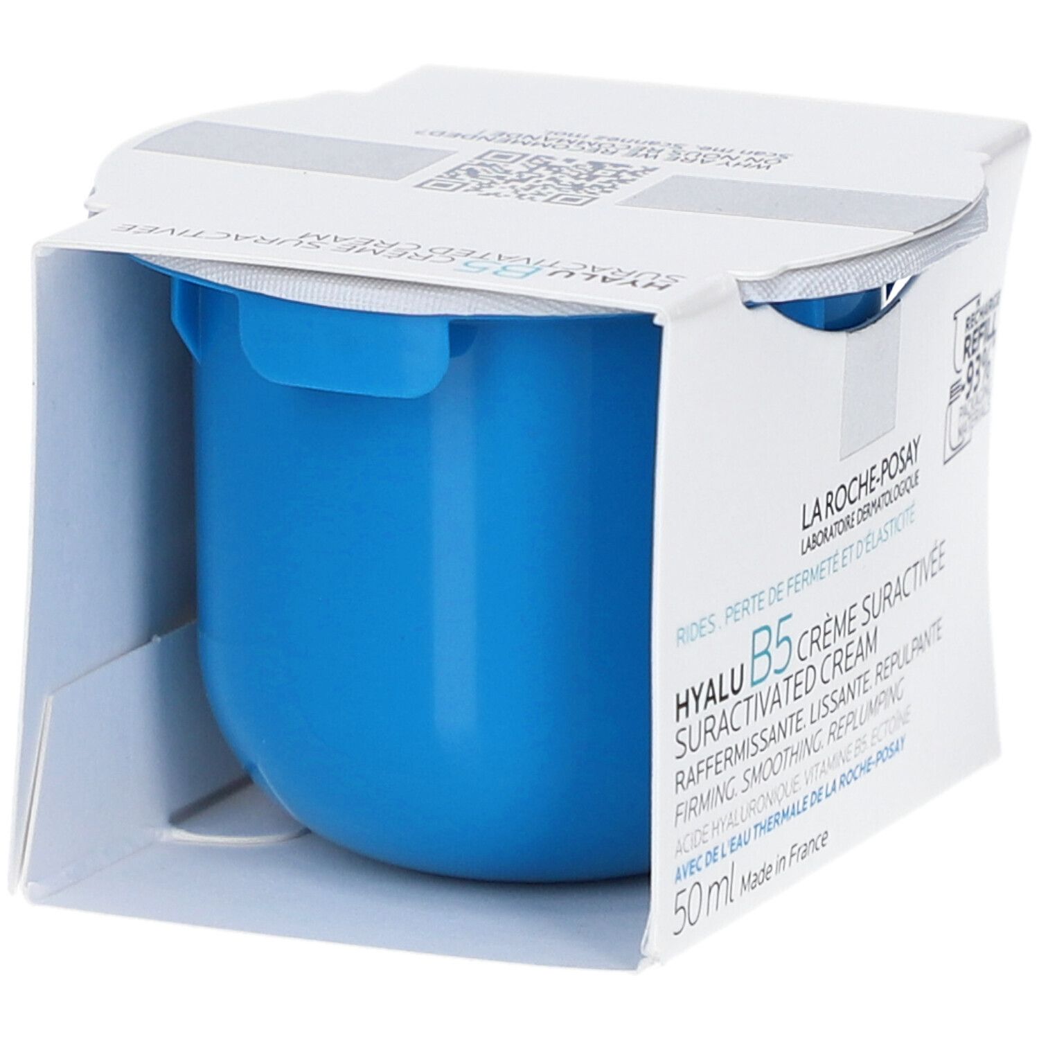 Blauer Cremetiegel in weißer Verpackung. Aufschrift: Hyalu B5 Crème Suractivée. Sichtbare blaue Creme. Verpackung.