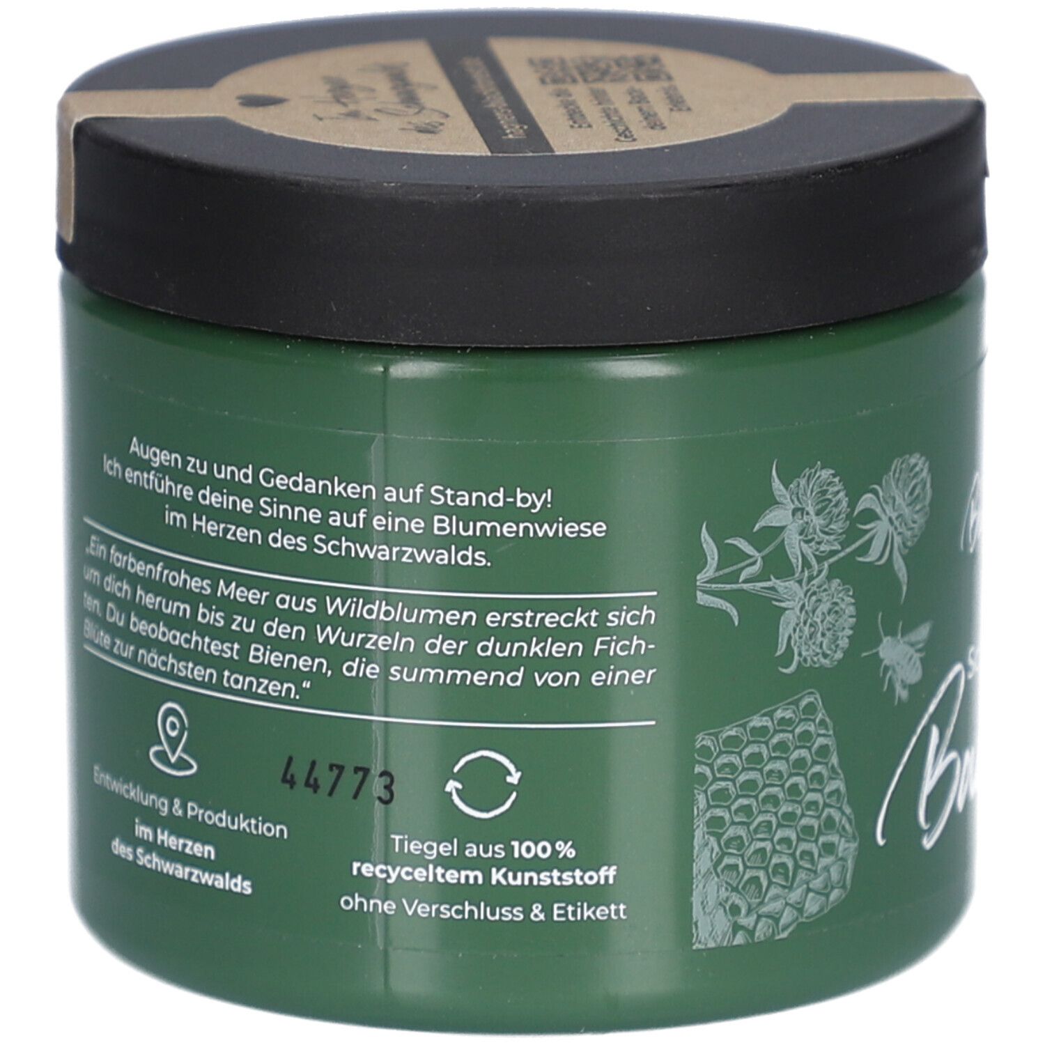 Grünes Glas mit schwarzem Deckel. Text auf Deutsch. Illustrationen von Blumen und Bienen. Recycling-Symbol.