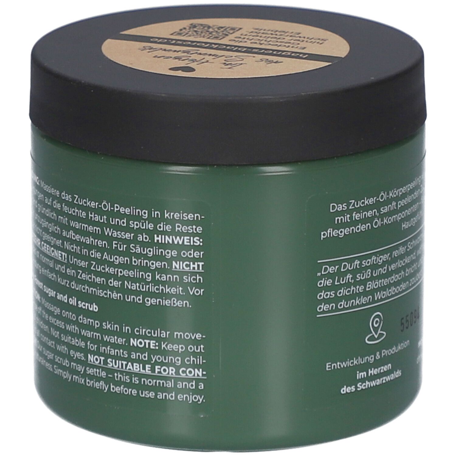 Grüner Tiegel mit Text. Text: Zucker-Öl-Peeling, Anwendung, Hinweis: Nicht in die Augen bringen. Nicht für Säuglinge.