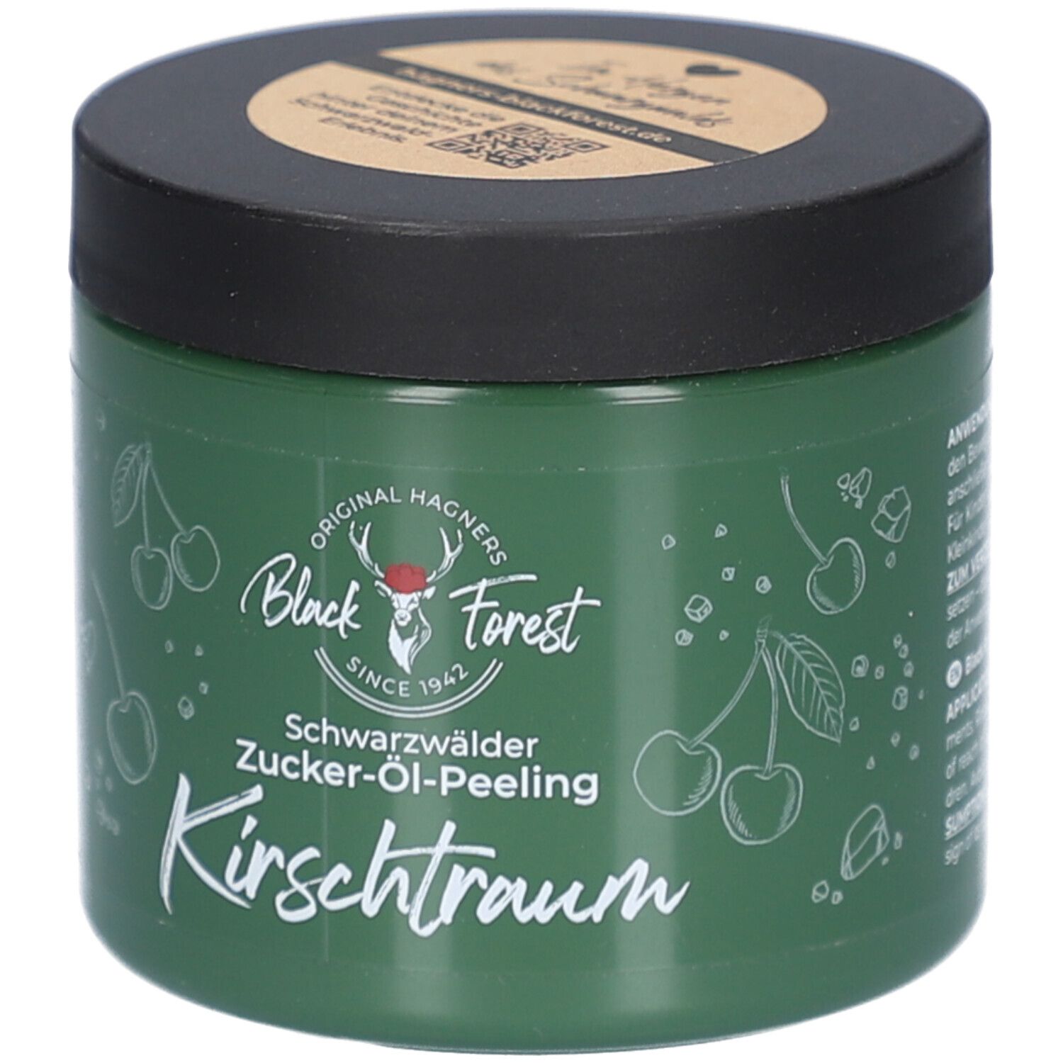Grüner Tiegel mit schwarzem Deckel. Aufschrift: Original Hagners Black Forest, Schwarzwälder Zucker-Öl-Peeling Kirschtraum. Kirsch-Illustrationen.