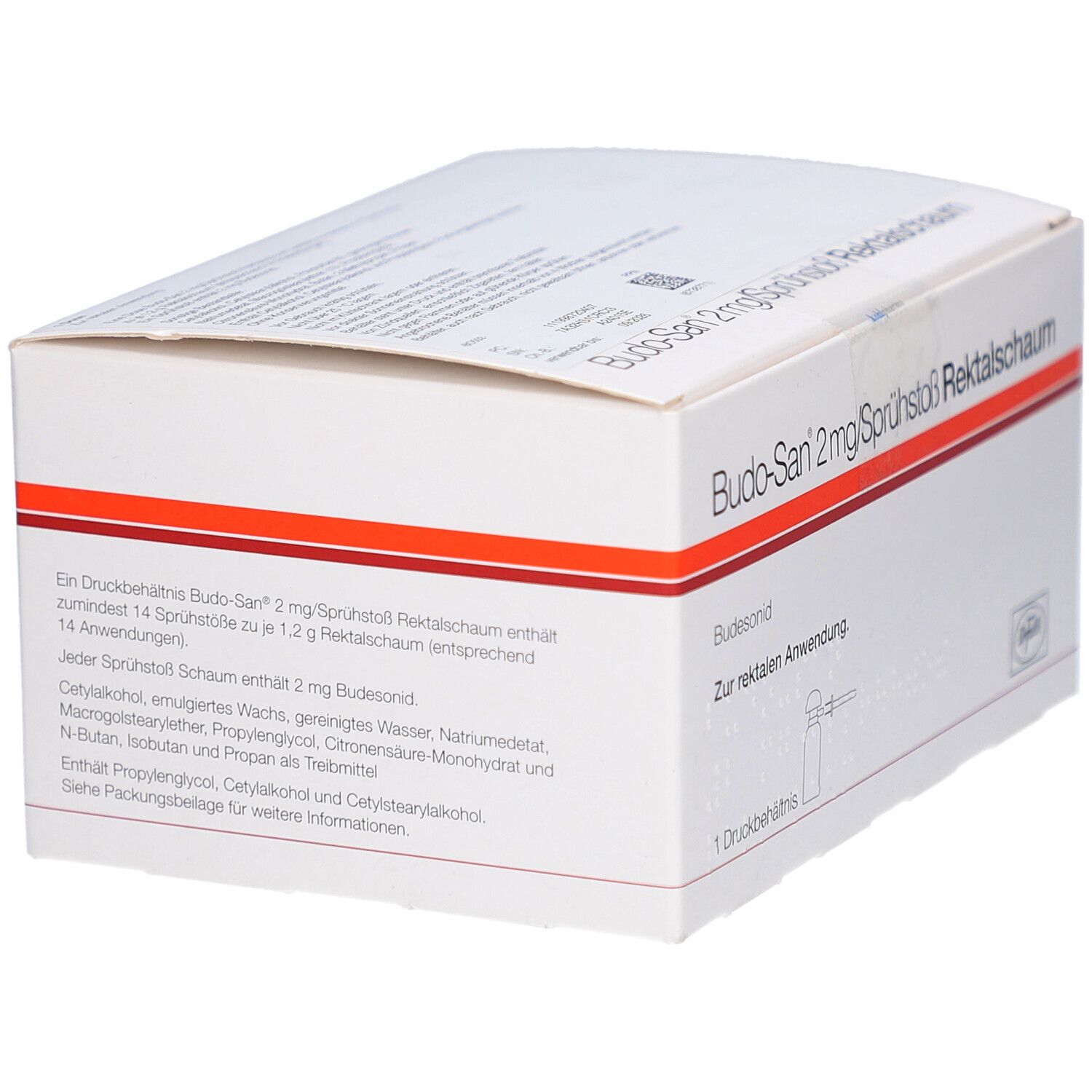 Weiße Kartonverpackung mit rotem Streifen. Text: Budo-San 2mg/Sprühstoß Rektalschaum. Enthält 14 Anwendungen. Inhaltsstoffe.