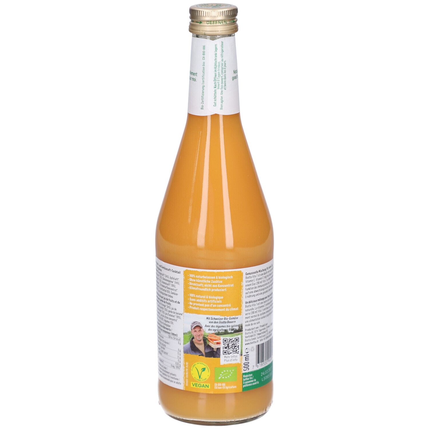 Rückansicht einer Glasflasche mit Saft. Etikett mit Informationen, Vegan-Siegel und Bio-Siegel.