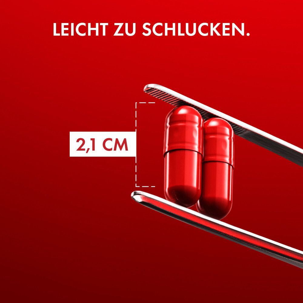 Zwei rote Kapseln in einer Pinzette. Text: Leicht zu schlucken. Maße: 2,1 cm.