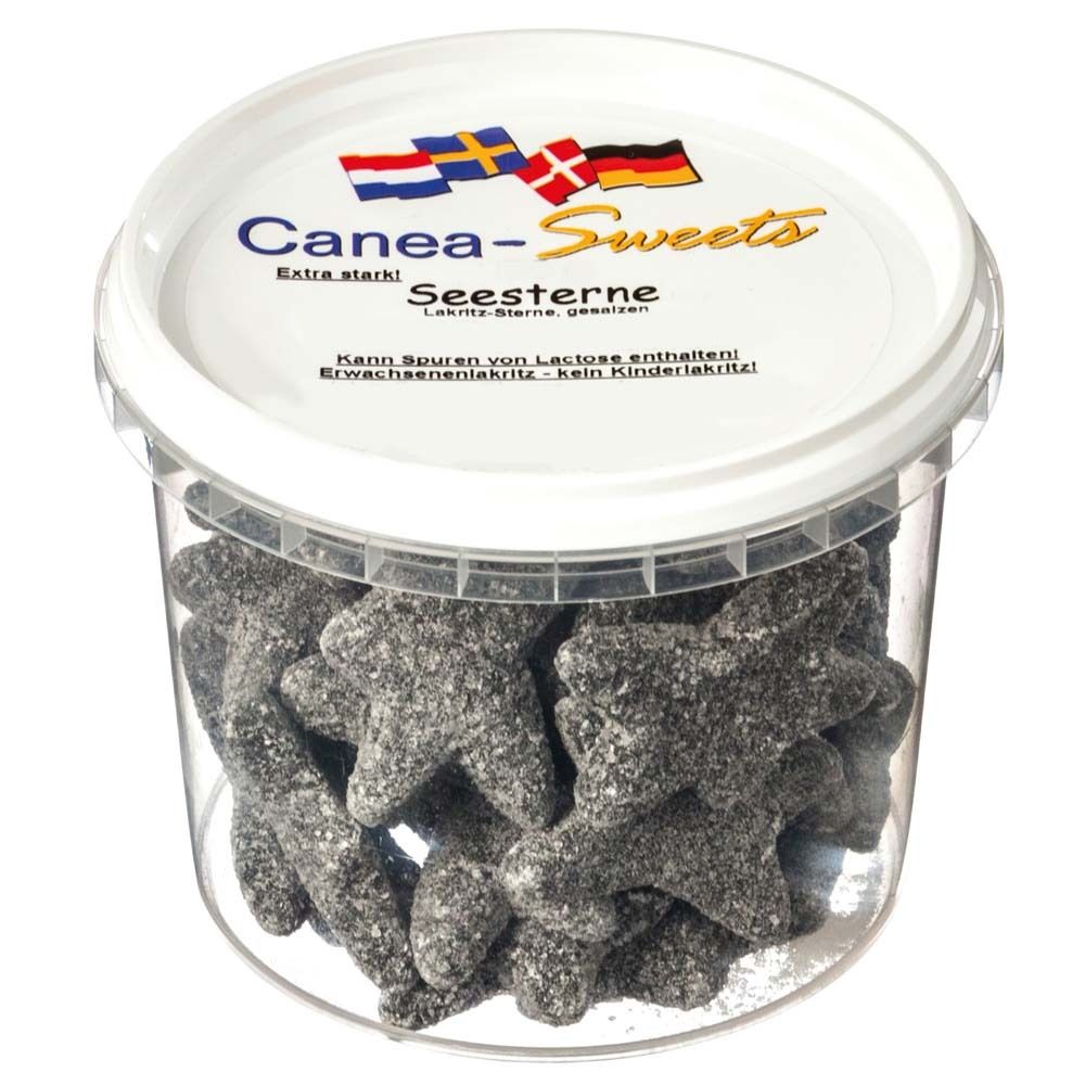 Behälter mit Canea-Sweets Seesterne. Schwarze, sternförmige Lakritzbonbons. Deckel mit Logo und Flaggen.