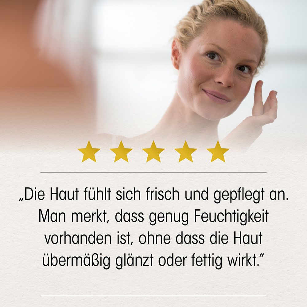 Frau berührt ihr Gesicht. Text: Die Haut fühlt sich frisch und gepflegt an. Man merkt, dass genug Feuchtigkeit vorhanden ist, ohne dass die Haut glänzt.