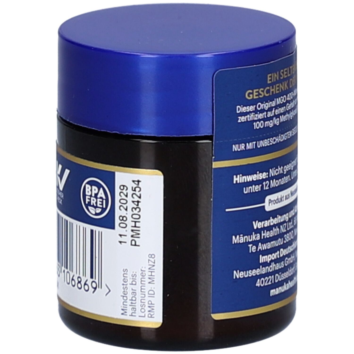 Braunes Glas mit blauem Deckel. Aufschrift: Mānuka Health, BPA frei, Mindestens haltbar bis: 11.08.2029.